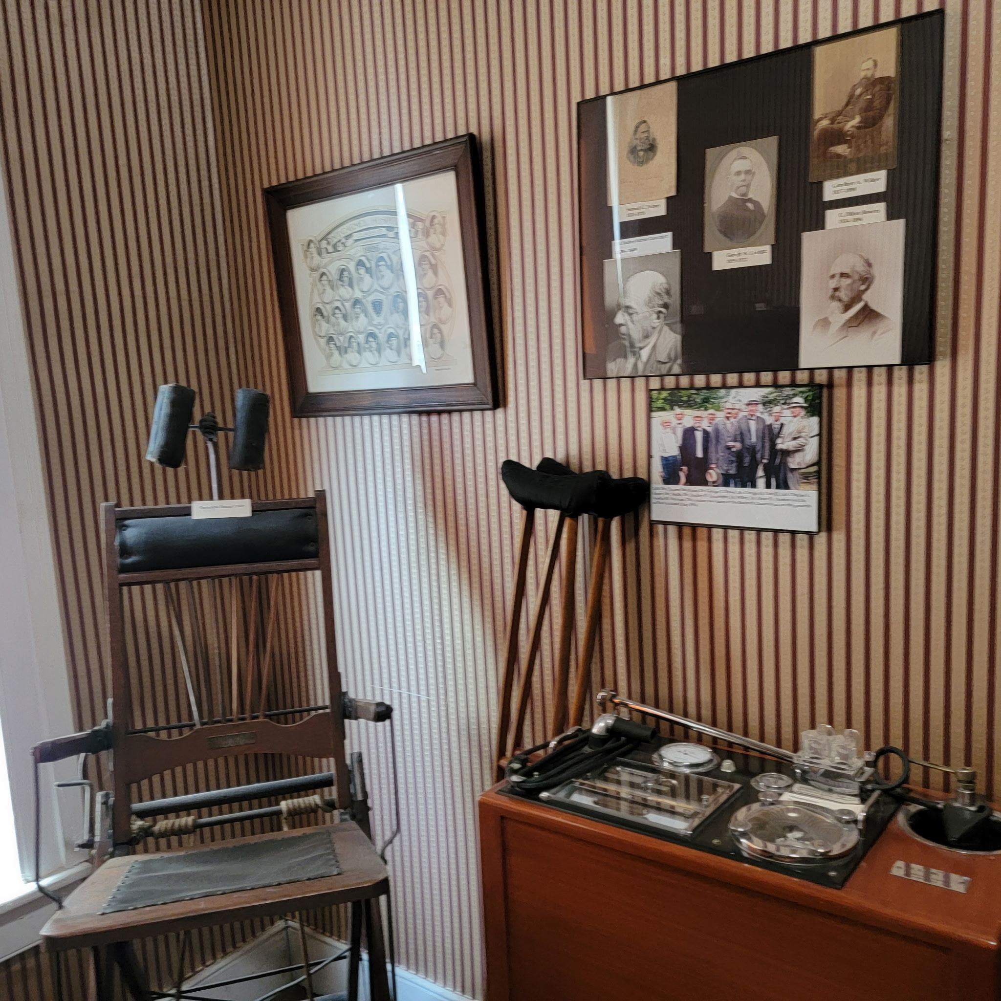 Antique dental chair, crutches and instrument tray in the dentistry exhibit